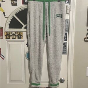 Ladies Gray and Green Joggers featuring North Dakota. NWOT